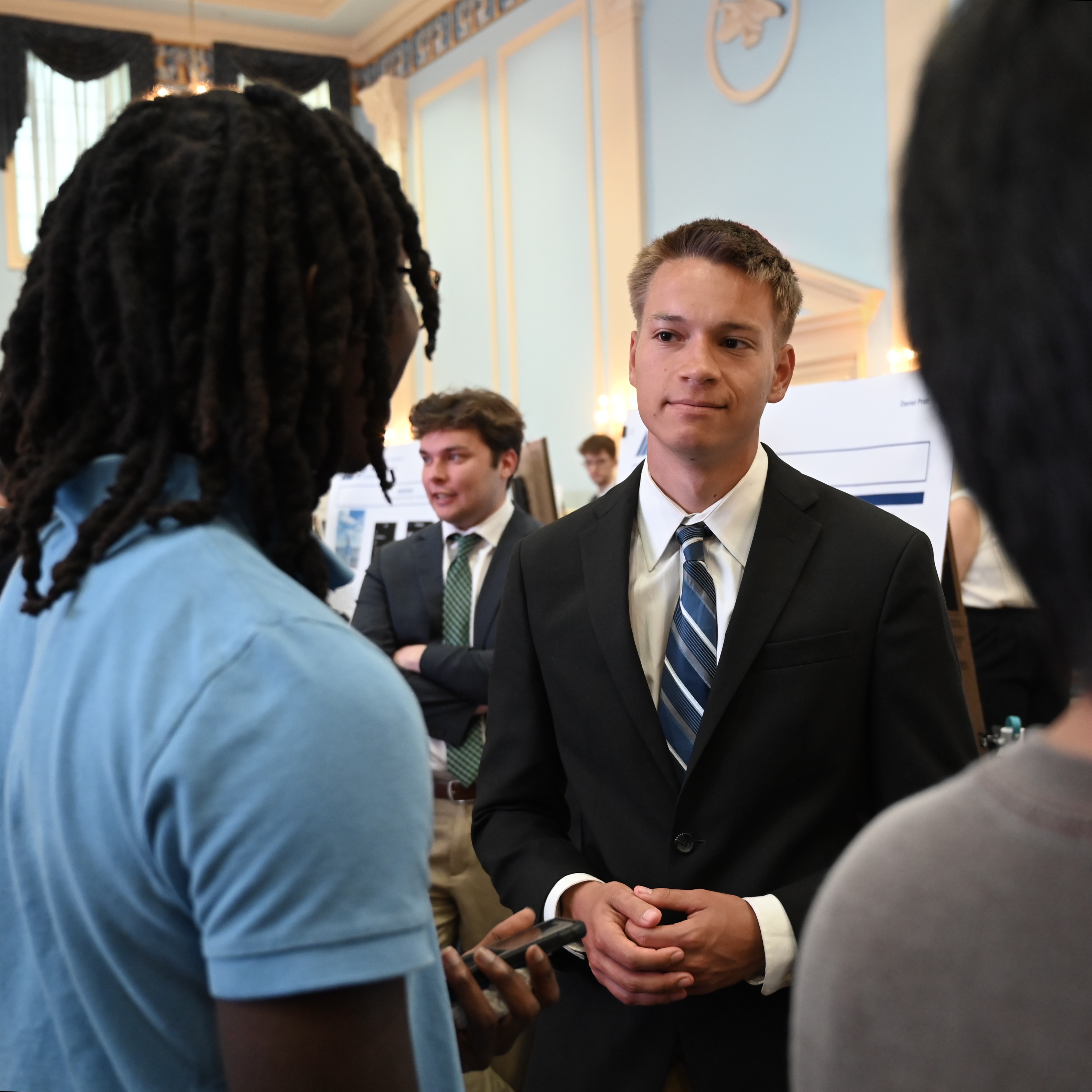 Student demonstrating a project prototype to a faculty member